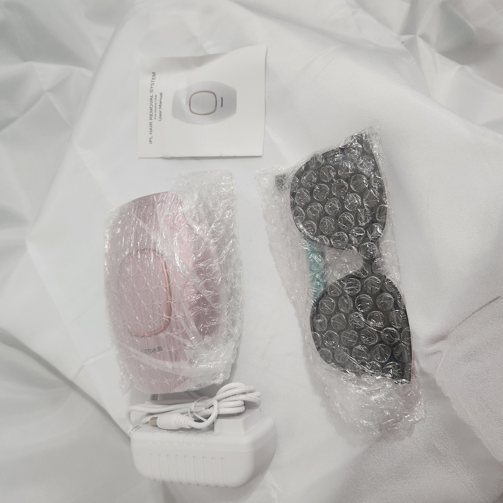 Pink Electronic Device with Accessories